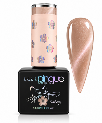 Tickled Pinque Cosmetics Cateye gel nail polish bottle in a black square container with a pale pink floral cap, shown next to a large almond-shaped nail swatch displaying the shimmery nude-rose polish color.