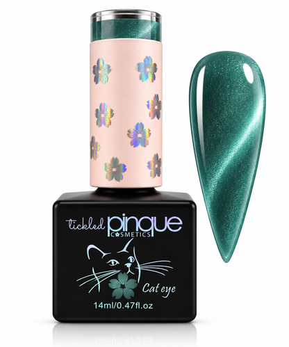 Tickled Pinque Cosmetics 'Cat eye' nail polish bottle with a black base, a pale pink cap decorated with iridescent flowers, and a large swatch of the shimmering teal-green polish shown on the right.