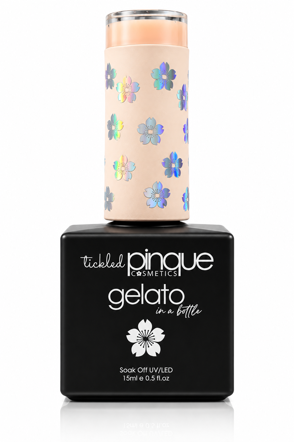 Tickled Pinque Cosmetics Gelato soak off nail polish in a bottle with a black base and a pale peach cap decorated with iridescent blue and purple flowers.