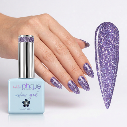 A bottle of nail polish gel with a hand and a large nail swatch showing a sparkling lavender-purple glitter finish on a clean white background.